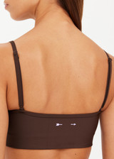 THE UPSIDE women's brown eco tech Oxford Hutton Scoop Sports Bra offers a mid coverage shelf bra with removable cups and adjustable straps. Designed with lilac coloured binds down the side. Made for high impact.