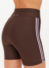 THE UPSIDE women's brown eco tech Oxford 5Inch Spin Short offers a mid rise with lilac coloured binds down side seams and an elastic drawcord through waist. Made for high impact.
