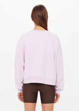 THE UPSIDE women's purple 100% organic cotton Paloma Crew features a ribbed neckline, cuff and hems in a relaxed fit. Made for lifestyle.