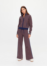 THE UPSIDE women's brown organic cotton Lumiere Juniper Knit Pant is a straight leg pant with a geometric star pattern, a soft elasticated waistband with drawcord and side seam pockets. Made for lifestyle.
