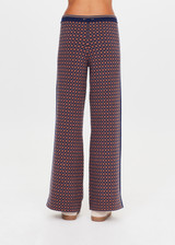 THE UPSIDE women's brown organic cotton Lumiere Juniper Knit Pant is a straight leg pant with a geometric star pattern, a soft elasticated waistband with drawcord and side seam pockets. Made for lifestyle.