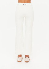 THE UPSIDE women's cream Bonnie Kick Flare Pant is a mid-rise, cropped flare pant made in a heavy ponte fabrication with a soft elastic waistband and embroidered arrow logo at back.