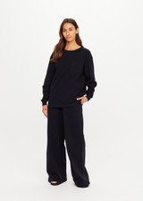 THE UPSIDE women's black recycled cotton Soho Cara Long Sleeve Top is designed for a relaxed fit and features a ribbed neck and cuffs and a patch pocket at front. Made for everyday leisure.