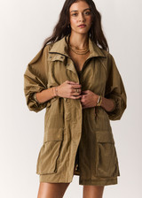 THE UPSIDE women's brown Rylan Anorak is designed for a relaxed fit, mid-length, made from tan wrinkled water-resistant fabric. Made for lifestyle.