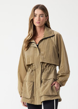 THE UPSIDE women's brown Rylan Anorak is designed for a relaxed fit, mid-length, made from tan wrinkled water-resistant fabric. Made for lifestyle.