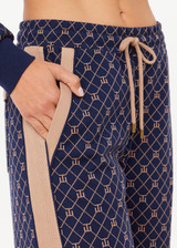 THE UPSIDE women's monogram jacquard Ezra Nova Flare Pant features a monogram geometric design and an elasticated waistband with drawcord. Made for lifestyle.