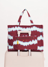 THE UPSIDE women’s tie dye organic cotton Rio Quilted Tote Bag has external and internal pockets, a waterbottle holder, and slips easily on suitcase. Made for lifestyle.