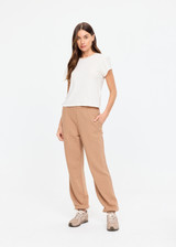 THE UPSIDE women's brown organic cotton Marlon Harrison Track Pant is true-to-size and features side stripes, side seam pockets and elasticated cuffs. Made for lifestyle.