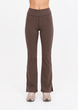 THE UPSIDE women's check recycled peached Zinnia Florence Flare Pant combines a soft and supportive fit with a mid rise waist and textured jacquard fabrication. Made for yoga and pilates.