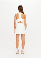 THE UPSIDE women’s cream recycled Kova Racerback Dress has built in shorts with pockets, a scooped front neckline with a racerback bra. Made for tennis.