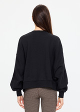 THE UPSIDE women's black organic cotton Paloma Crew is designed for an oversized fit and features dropped shoulders, ribbed trims and rhinestone logo detailing. Made for lifestyle.