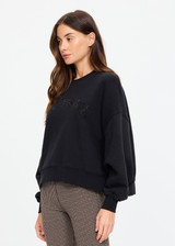 THE UPSIDE women's black organic cotton Paloma Crew is designed for an oversized fit and features dropped shoulders, ribbed trims and rhinestone logo detailing. Made for lifestyle.
