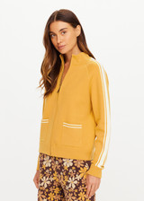 THE UPSIDE women's yellow organic cotton Bonito Dylan Knit Jacket offers a relaxed fit and features raglan sleeves, front patch pockets and contrast stripe detailing. Made for lifestyle.
