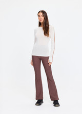 THE UPSIDE women's natural Merino Wool Long Sleeve Top is designed for a slim fit and features a crew neckline, contrast sleeve stripe and soft fine knit feel. Made for lifestyle.