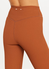 THE UPSIDE women’s brown recycled jacquard Mariana 25inch High Midi Legging offers a soft and supportive fit and features a high rise waist and V panel waistband. Made for yoga and pilates.