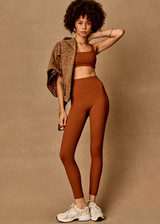 THE UPSIDE women’s brown recycled jacquard Mariana 25inch High Midi Legging offers a soft and supportive fit and features a high rise waist and V panel waistband. Made for yoga and pilates.