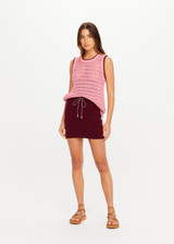 THE UPSIDE women's maroon organic cotton Zelma Knit Mini Skirt is a true to size fit with contrast side stripe detailing and an adjustable drawcord waist. Made for lifestyle.