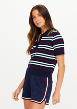 THE UPSIDE women’s stripe 100% organic cotton Archie Collared Knit Polo is true to size and features a striped rib collar, button front closure and ribbed hem. Made for tennis.