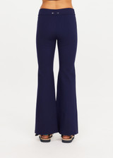 THE UPSIDE women’s navy sustainable Joyela Panelled Flare Pant is mid rise and features an internal elasticated waistband, front and back darts and contrast side stripe tape. Made for lifestyle.
