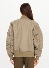 THE UPSIDE women's olive Tribute Bomber Jacket is a true to size style featuring a water resistant finish, paisley lining, ruched sleeve detailing and multiple utility pockets. Made for lifestyle.