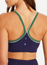 THE UPSIDE women's navy Rhythm Faye Racerback Bra is designed for a supportive and comfortable fit and features a scooped neckline, T-bar back and built in shelf bra with removable cups. Made for pilates.