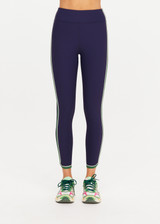 THE UPSIDE women's navy Rhythm 25inch Legging is a supportive and comfortable fit and features a mid rise waist, contrast side binding and streamlined rib fabrication. Made for yoga and pilates.