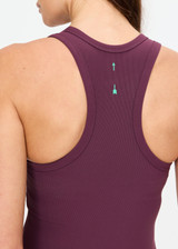 THE UPSIDE women's plum Pele Sophie Tank Top is designed for a supportive and comfortable fit and features a racerback silhouette, built-in shelf bra with removable cups and soft rib fabrication. Made for yoga and pilates.