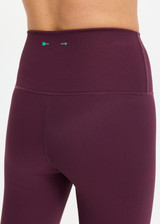 THE UPSIDE women's plum Pele 25inch Legging is designed for a supportive and comfortable fit and features a high rise waist, recycled rib fabrication and clean tonal finish. Made for yoga and pilates.