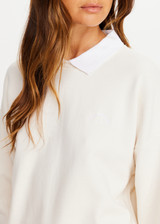 THE UPSIDE women's natural organic cotton Pascal Collared Crew offers a relaxed fit and features a collared neckline, scalloped edge detailing and ribbed trims. Made for lifestyle.