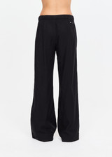 THE UPSIDE women's black lyocell linen blend Noir Elita Pant offers a true to size fit with a mid rise waist, contrast piping and slanted side seam pockets. Made for lifestyle.