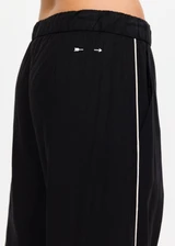 THE UPSIDE women's black lyocell linen blend Noir Elita Pant offers a true to size fit with a mid rise waist, contrast piping and slanted side seam pockets. Made for lifestyle.