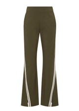 THE UPSIDE women's green Petra Flare Pant combines a true-to-size mid rise fit with side seam pockets, striped side tape and hem splits. Made for lifestyle.