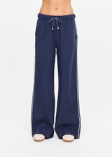THE UPSIDE women's navy Lago Elita Pant is designed for a true-to-size mid rise fit and features a wide leg silhouette, side pockets and an adjustable drawcord waist. Made for lifestyle.