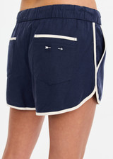 THE UPSIDE women's navy Lago Marlin Short crafted for a true-to-size low rise fit with side and back pockets, contrast binding and an adjustable drawcord waist. Made for lifestyle.