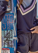 THE UPSIDE women's navy Lago Marlin Short crafted for a true-to-size low rise fit with side and back pockets, contrast binding and an adjustable drawcord waist. Made for lifestyle.