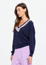 THE UPSIDE women's navy linen cotton blend Bonita V Neck Knit features a regular fit and dropped shoulders, striped neckline detailing and ribbed trims. Made for lifestyle.