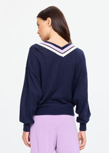 THE UPSIDE women's navy linen cotton blend Bonita V Neck Knit features a regular fit and dropped shoulders, striped neckline detailing and ribbed trims. Made for lifestyle.