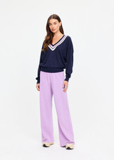 THE UPSIDE women's navy linen cotton blend Bonita V Neck Knit features a regular fit and dropped shoulders, striped neckline detailing and ribbed trims. Made for lifestyle.