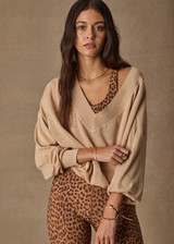 THE UPSIDE women’s sand linen organic cotton Bonita V Neck Knit is designed for a regular fit and features a wide neckline, dropped shoulders and ribbed trims. Made for lifestyle.