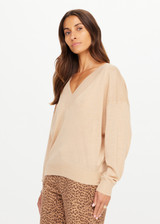 THE UPSIDE women’s sand linen organic cotton Bonita V Neck Knit is designed for a regular fit and features a wide neckline, dropped shoulders and ribbed trims. Made for lifestyle.