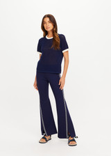 THE UPSIDE women’s navy 100% organic cotton Fenway Jordan Knit Tee offers a relaxed fit and features an open knit construction, contrast sleeve stripe detailing and ribbed trims. Made for lifestyle.