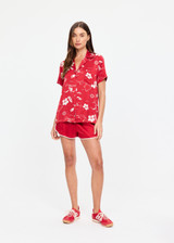 THE UPSIDE women's red  Dusty's Holiday Shirt is a short sleeve button-up in our holiday red and cream printed design and features a patch pocket on front chest. Made for lifestyle.