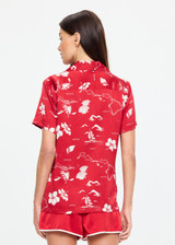 THE UPSIDE women's red  Dusty's Holiday Shirt is a short sleeve button-up in our holiday red and cream printed design and features a patch pocket on front chest. Made for lifestyle.