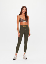 THE UPSIDE women's olive Laguna 25inch Legging offers soft support and features an orange drawcord and contrast cuffs at hem. Made for yoga & pilates.