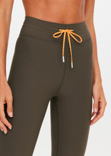 THE UPSIDE women's olive Laguna 25inch Legging offers soft support and features an orange drawcord and contrast cuffs at hem. Made for yoga & pilates.