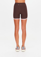 THE UPSIDE women's chocolate Rhythm 5inch Spin Short is mid-rise and features cream and light green binds along side seams in our recycled rib fabrication. Made for yoga and pilates.