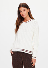 THE UPSIDE women's cream Millie V Neck Knit Sweater is designed for a relaxed fit and features a high v neckline and chocolate metallic stripes along cuffs, neckline and hem. Made for lifestyle.