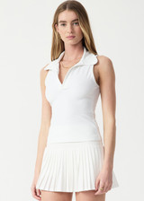 THE UPSIDE women’s white Game Greer Collared Tank Top is a soft, supportive fit with a low V-neck, bound armholes, collar and placket. Made for tennis.