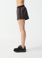 THE UPSIDE women’s brown Levi Run Short is a mid-rise style with a curved hem, ribbed elastic waistband and black mesh tape. Made for running.