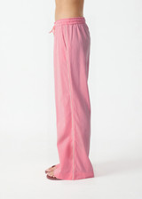 THE UPSIDE women’s pink Cortina Elita Pant is a mid-rise style with a soft elastic waistband, slanted side-seam pockets and cream piping. Made for lifestyle.